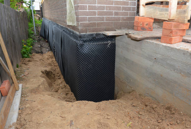 Happy homeowners after waterproofing job in Mayville